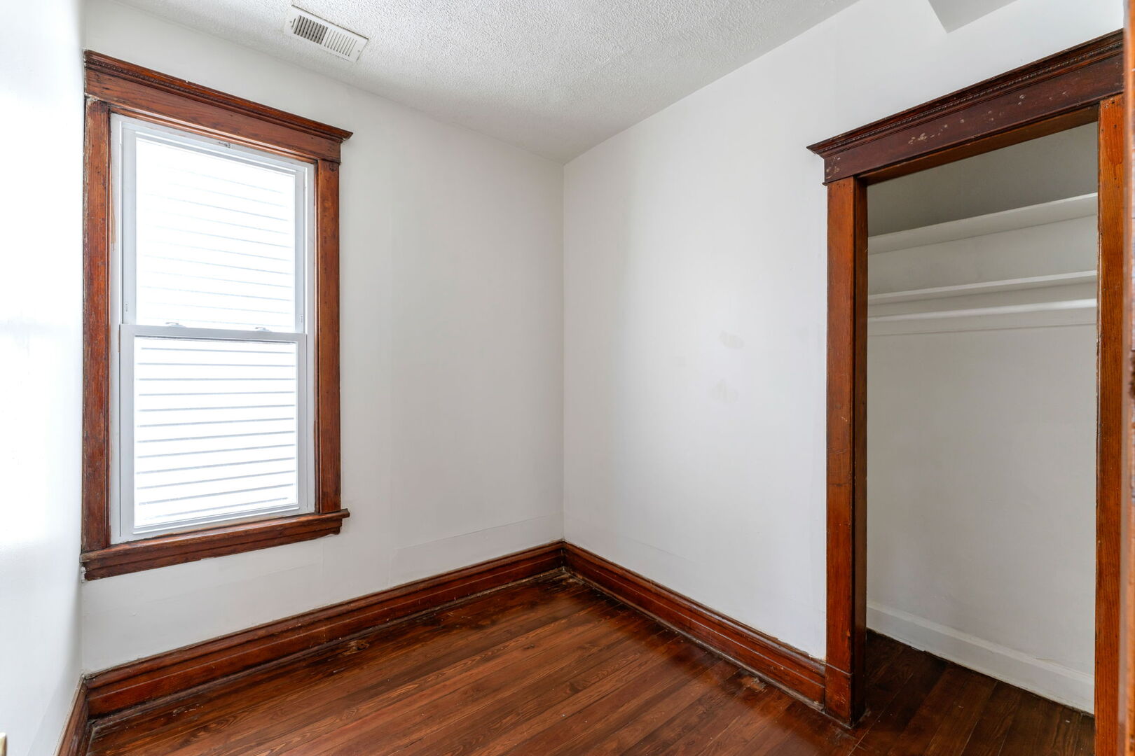 1921 North Pulaski Road, Unit 2 Chicago, IL 60639 - Photo 8 of 15 a view of empty room with wooden floor and fan