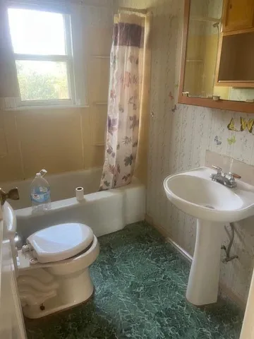 a bathroom with a sink and a toilet