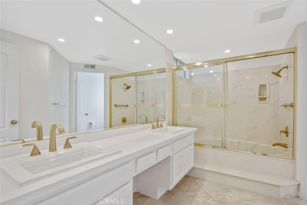 5974 Ruthwood Drive Calabasas, CA 91302 - Photo 15 of 30 a bathroom with a tub shower sink and mirror