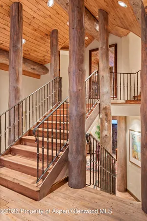 a dining hall with stainless steel appliances granite countertop a stove and a dining table view