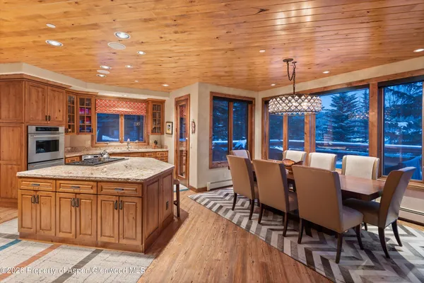 a kitchen with stainless steel appliances granite countertop a stove and a refrigerator