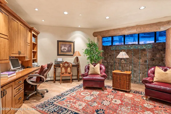 a bedroom with furniture and a fireplace