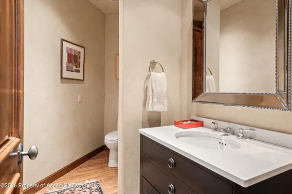 a bedroom with a bed and lamp