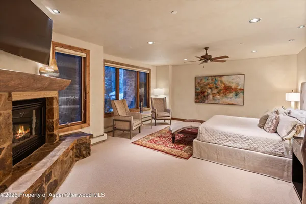 a bathroom with a tub a sink and mirrors