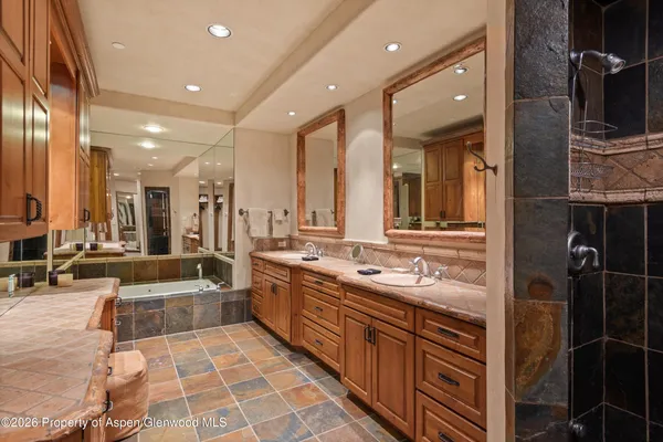 a bedroom with a bed and a television