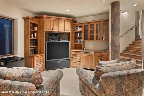 a view of a swimming pool with an outdoor seating