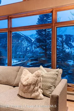 a view of a house with a balcony and furniture