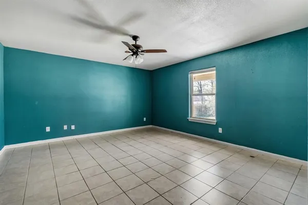 a view of an empty room with windows
