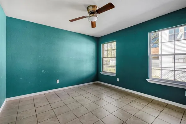 wooden floor in a room next to a window