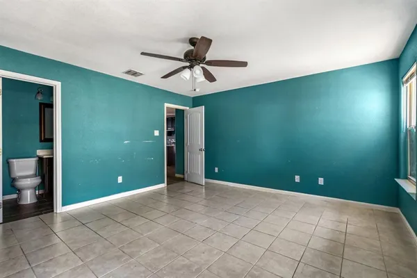 a view of an empty room with a bathroom