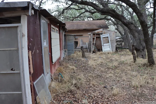a view of a house with a small yard