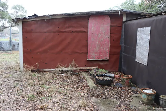 a wooden door in front of a house