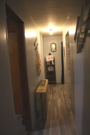 a room with gym equipment and view of living room