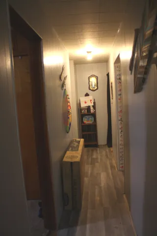 a room with gym equipment and view of living room