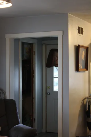 a room with furniture and a flat screen tv