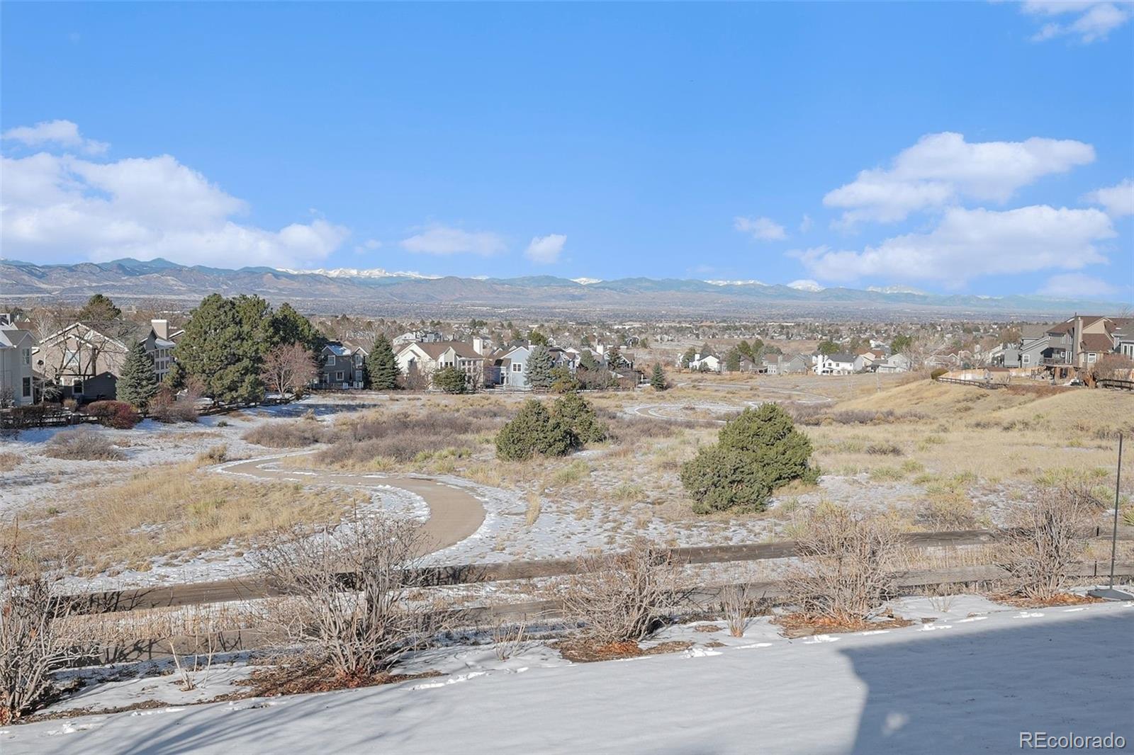 9537 Chesapeake Street Highlands Ranch, CO 80126 - Photo 12 of 34 a view of a beach with a ocean view