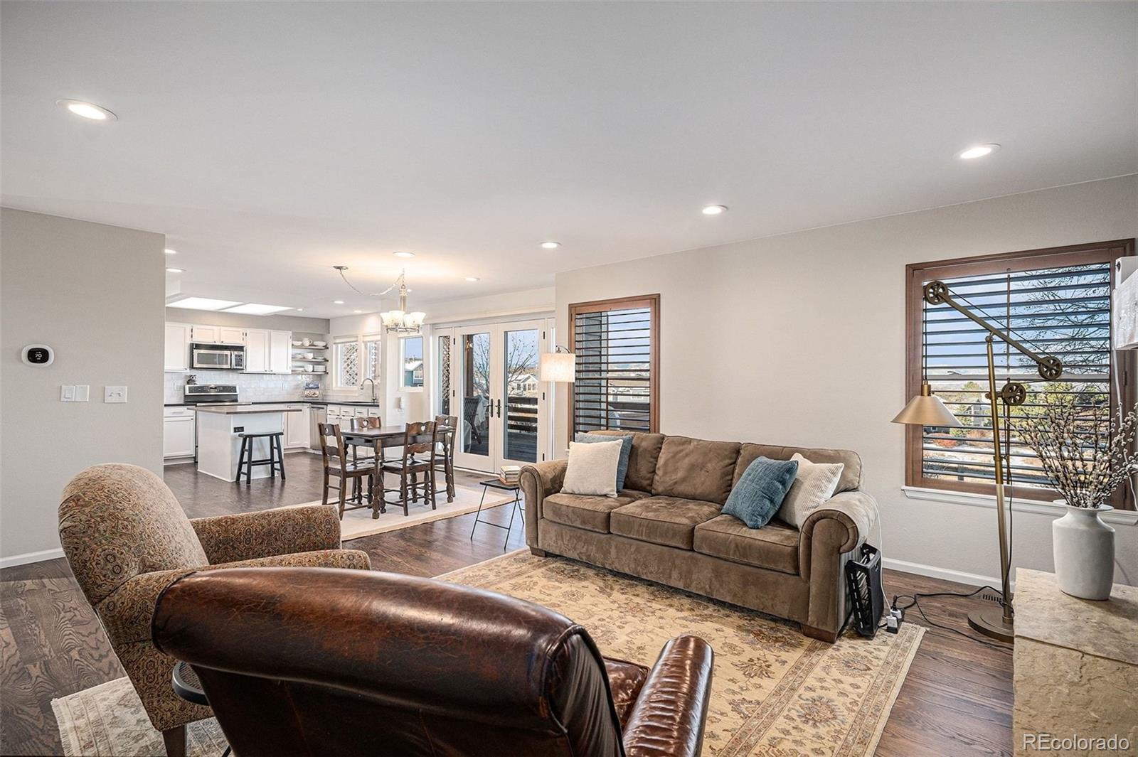 9537 Chesapeake Street Highlands Ranch, CO 80126 - Photo 16 of 34 a living room with furniture and a large window