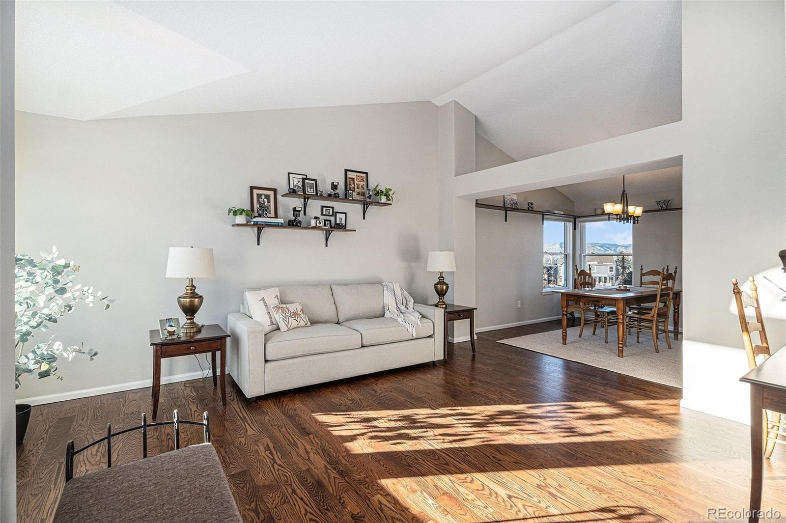 9537 Chesapeake Street Highlands Ranch, CO 80126 - Photo 23 of 34 a living room with furniture and a table