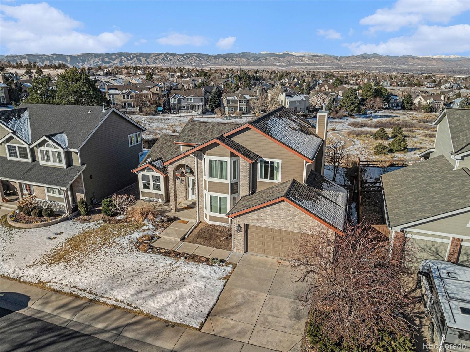 9537 Chesapeake Street Highlands Ranch, CO 80126 - Photo 30 of 34 aerial view of a house with a yard