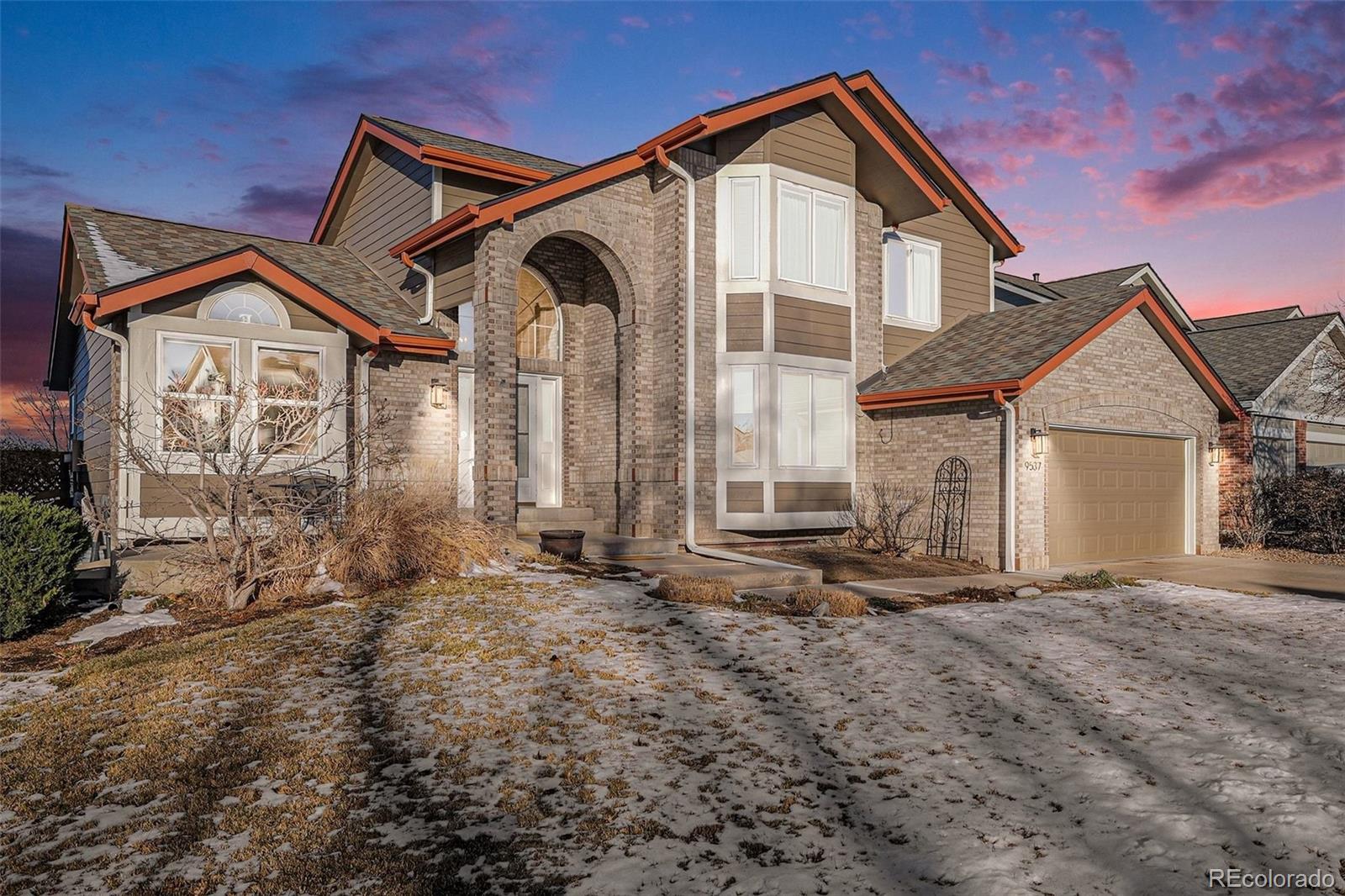 9537 Chesapeake Street Highlands Ranch, CO 80126 - Photo 3 of 34 a front view of a house with a yard