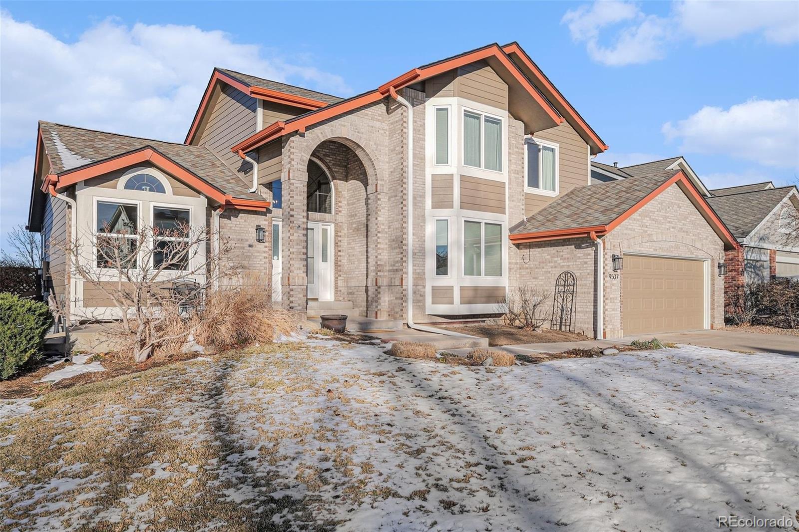 9537 Chesapeake Street Highlands Ranch, CO 80126 - Photo 31 of 34 a front view of a house with a yard