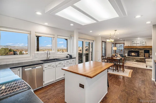 a large kitchen with lots of counter space a sink and appliances