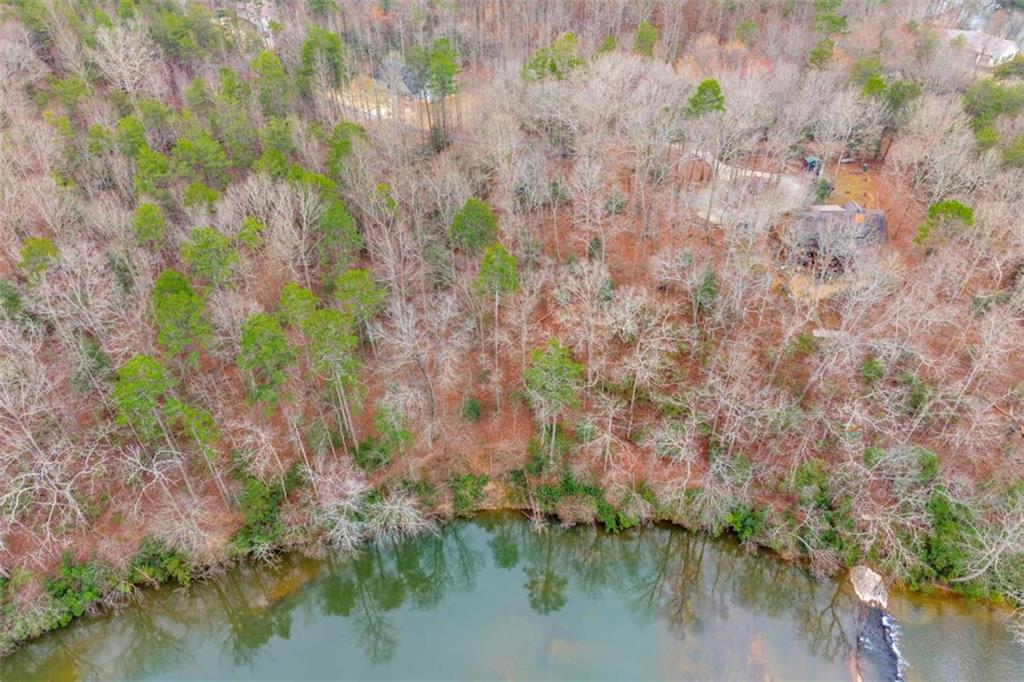 Lot 15 Old Timber Trail Cornelia, GA 30531 - Photo 21 of 31 a backyard of a house with lots of green space and lake view