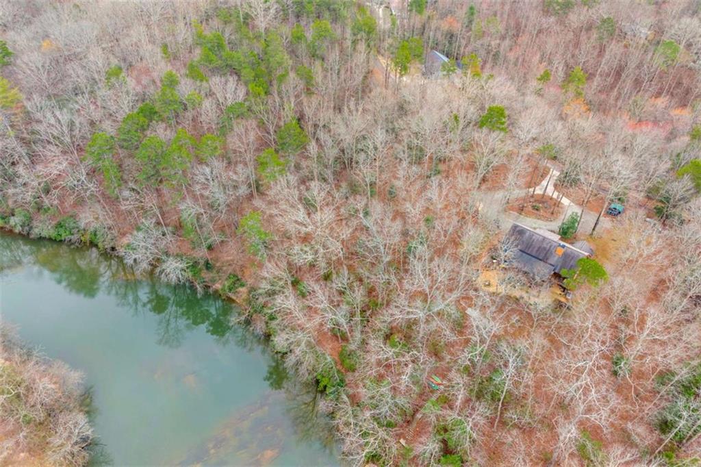 Lot 15 Old Timber Trail Cornelia, GA 30531 - Photo 22 of 31 a backyard of a house with lots of green space and lake view