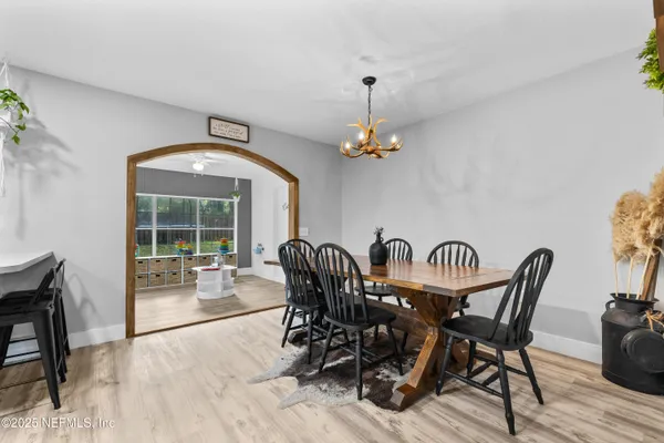 a view of a dining room with furniture window and outside view