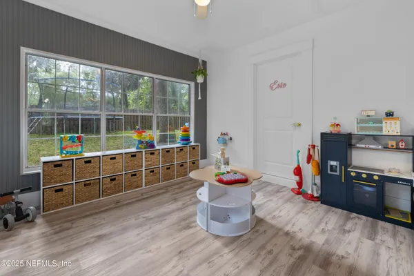 a dining room with wooden floor and dining table