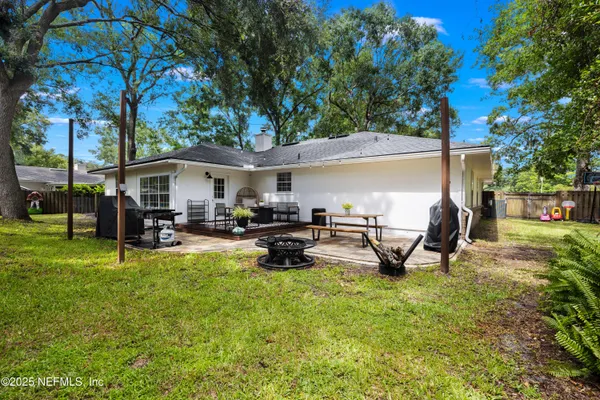 a view of a backyard with a patio