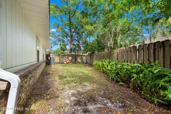 a backyard of a house with lots of green space