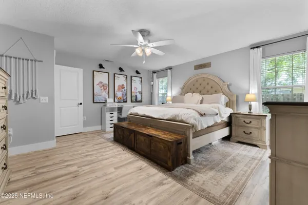 a bed room with a bed and a chandelier