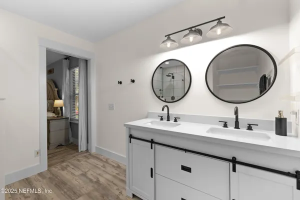 a bathroom with a sink and a mirror