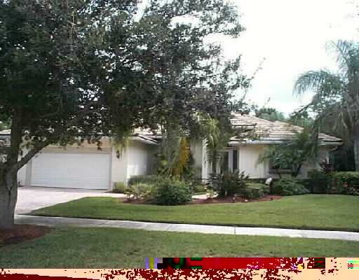 121 Victorian Lane Jupiter, FL 33458 - Photo 1 of 11 a front view of a house with a yard and a garage