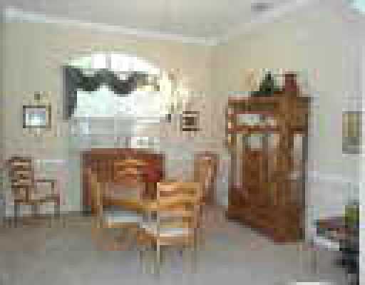 121 Victorian Lane Jupiter, FL 33458 - Photo 5 of 11 a room with dining table and chairs