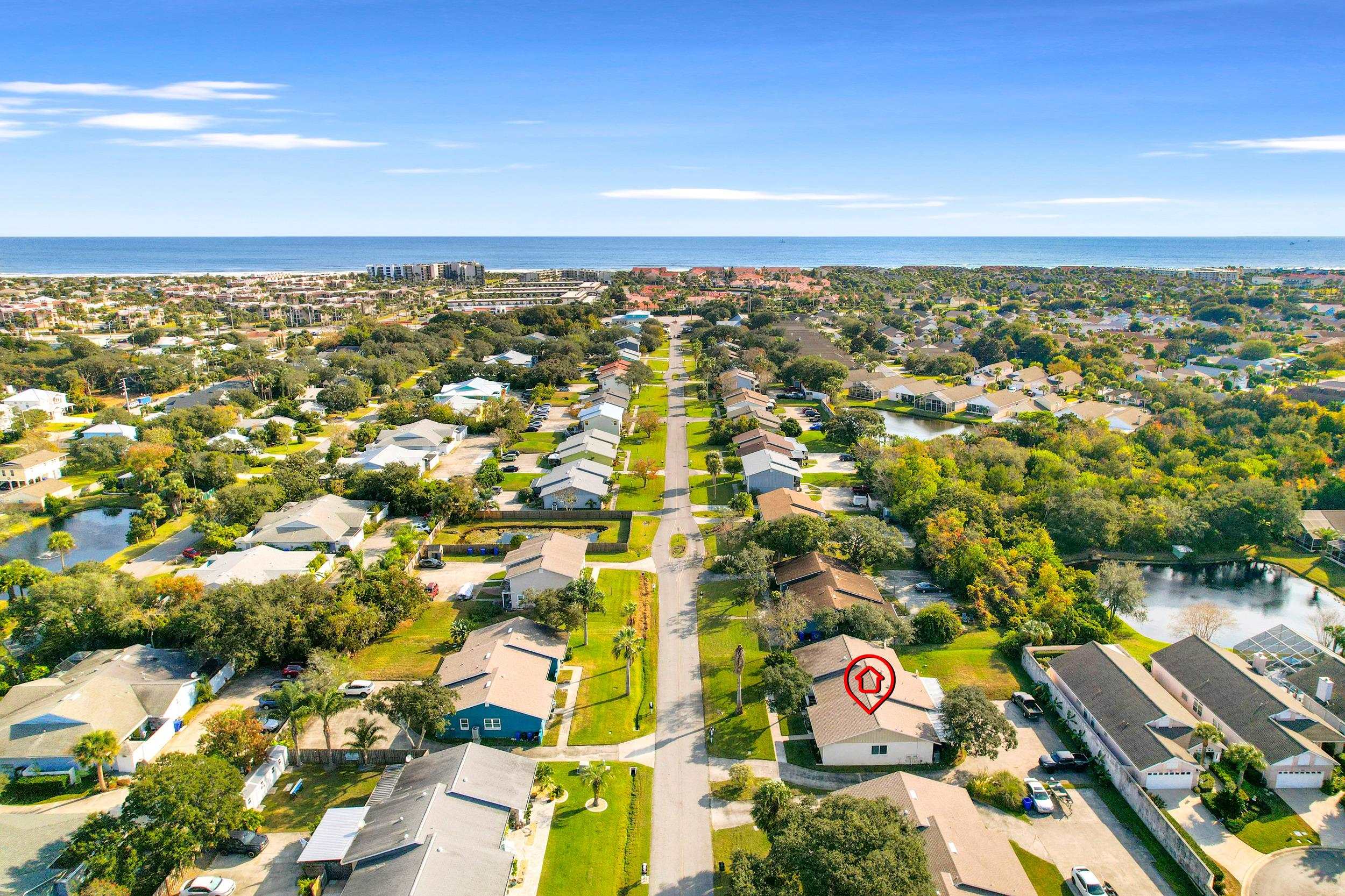 an aerial view of residential houses with outdoor space