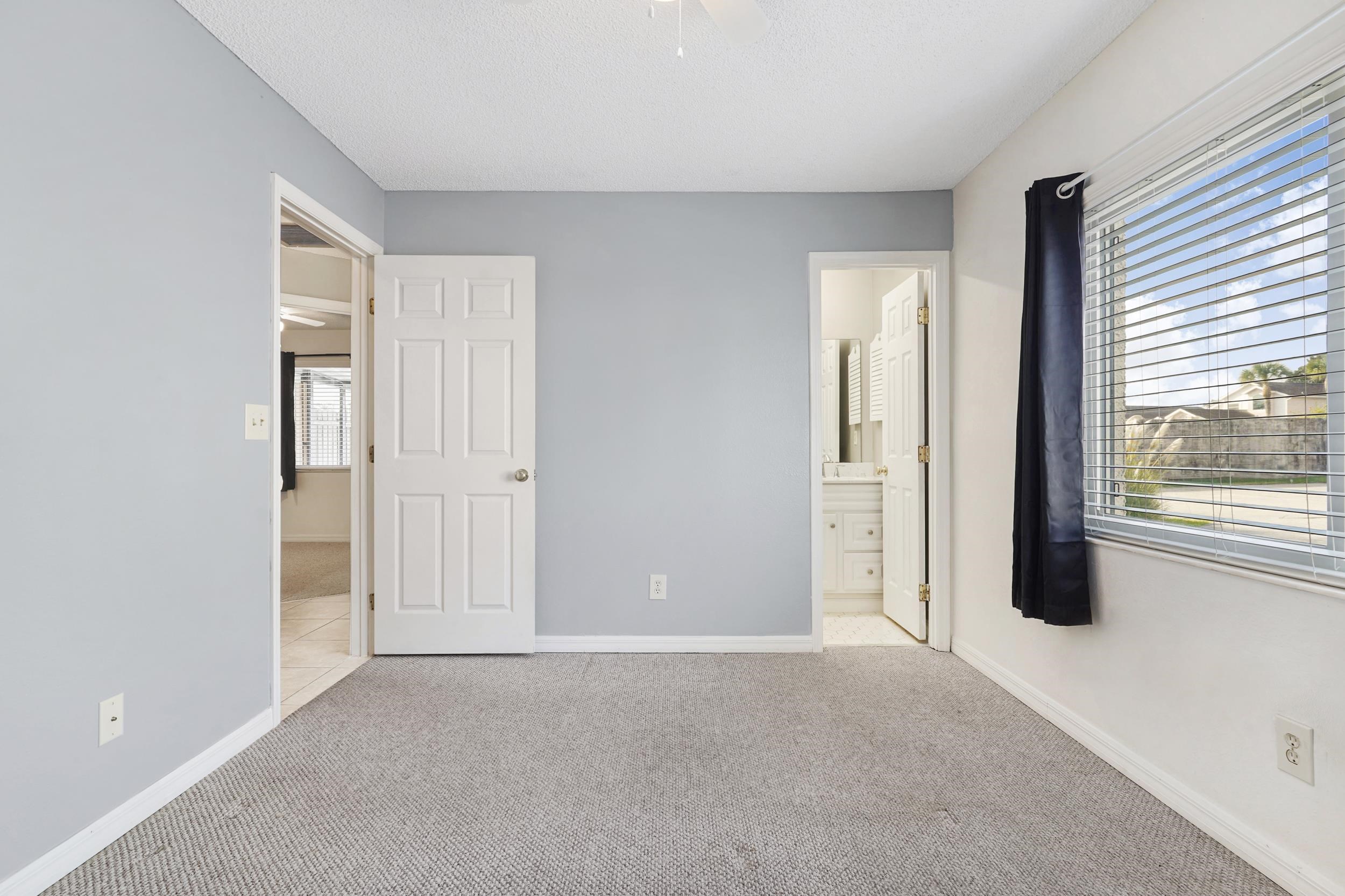 127 Rio Del Mar Street, Unit C St. Augustine, FL 32080 - Photo 16 of 29 an empty room with windows