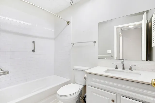 a bathroom with a sink a toilet and a bathtub
