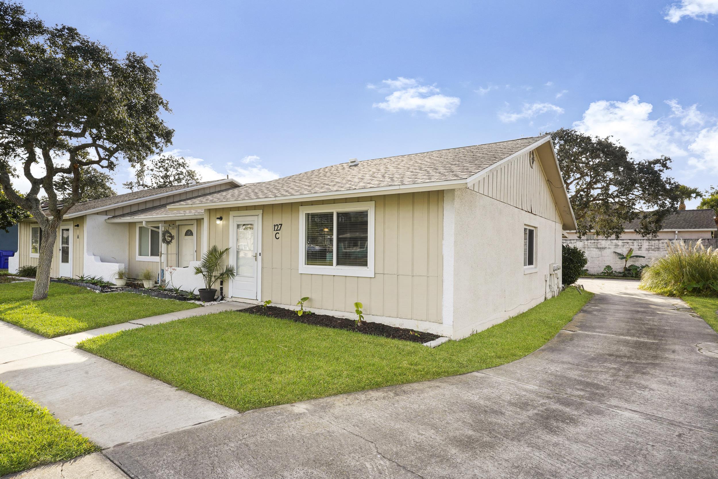 127 Rio Del Mar Street, Unit C St. Augustine, FL 32080 - Photo 2 of 29 Ranch-style house with roof with shingles
