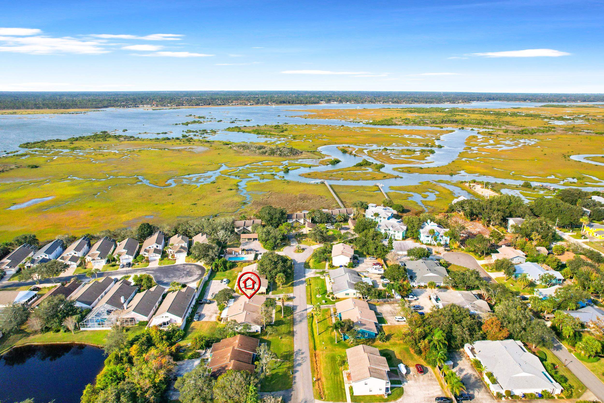 127 Rio Del Mar Street, Unit C St. Augustine, FL 32080 - Photo 25 of 29 Aerial overview of property's location with a nearby body of water and nearby suburban area