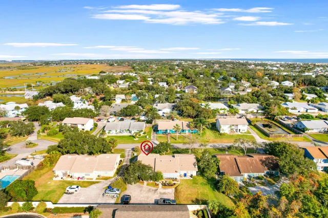 an aerial view of residential building and ocean