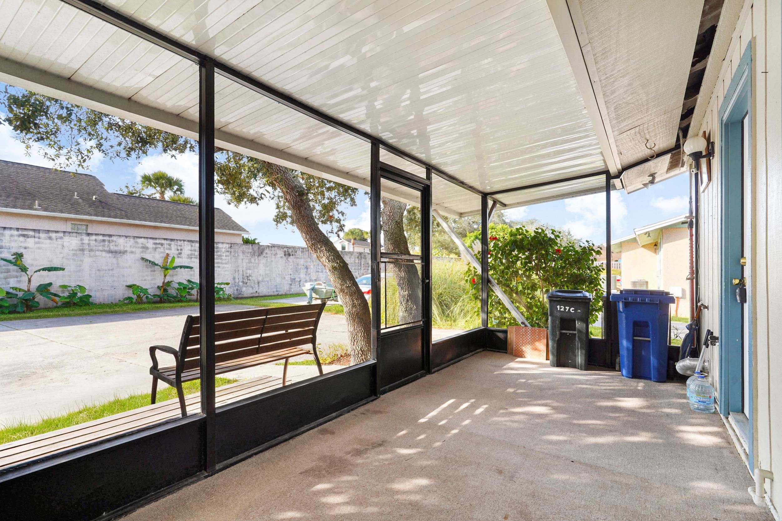127 Rio Del Mar Street, Unit C St. Augustine, FL 32080 - Photo 5 of 29 Unfurnished sunroom with healthy amount of natural light