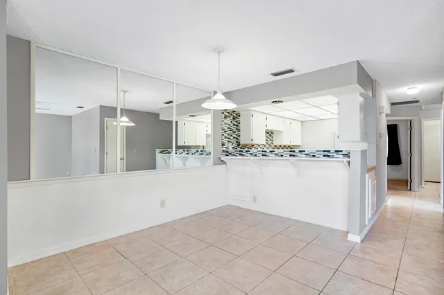 a view of a kitchen with a sink