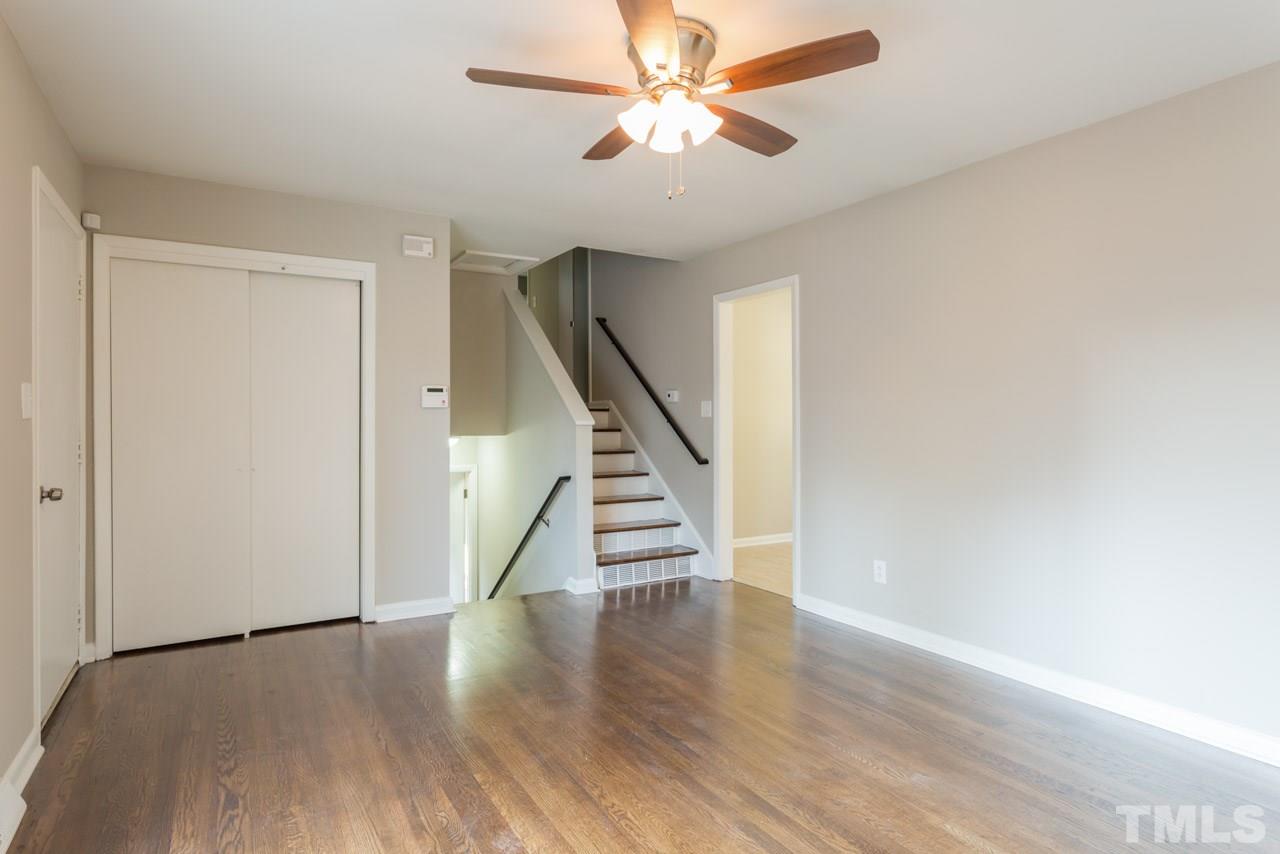 1012 Weston Street Raleigh, NC 27610 - Photo 9 of 23 a view of empty room with wooden floor and fan