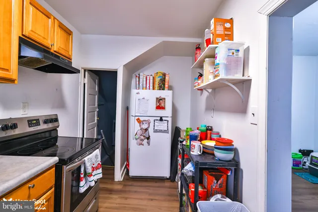a room with furniture a rug and a window