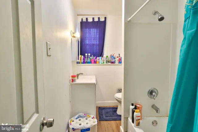 a bedroom with furniture and a closet