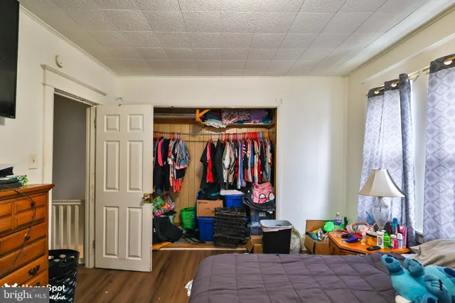 a view of a house with wooden deck and furniture