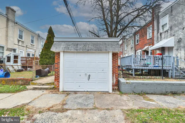 a front view of a house with outdoor seating