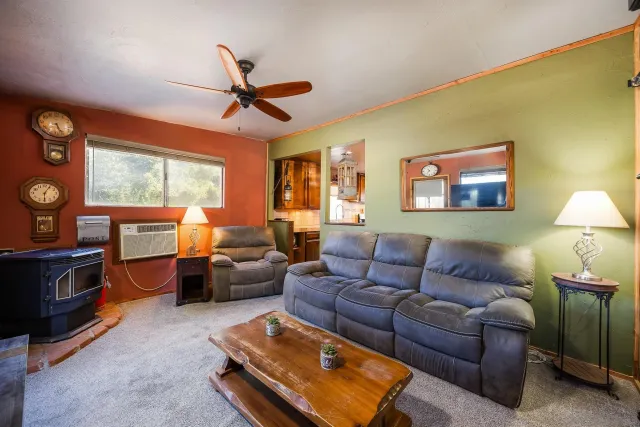 a view of a patio with a table chairs and a backyard